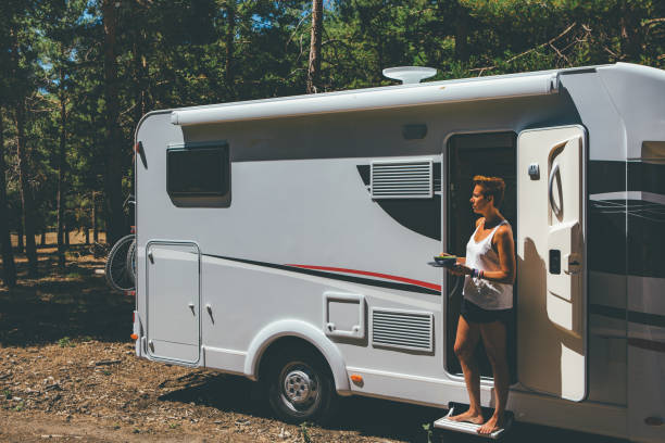 istock Girl has meal on a motor home 951081088