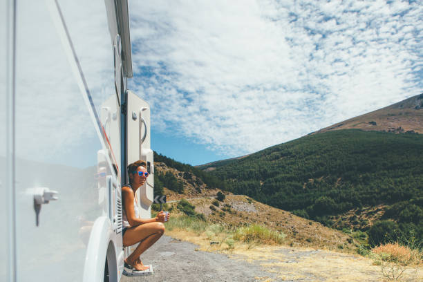 istock Girl holds a cup in a motor home 951081130