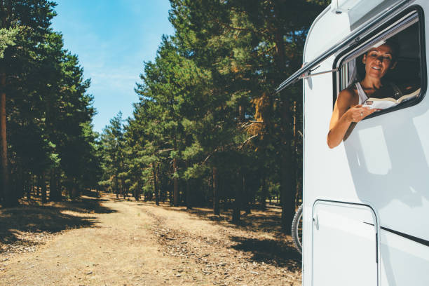 istock Girl reads a book in a motor home 951081134
