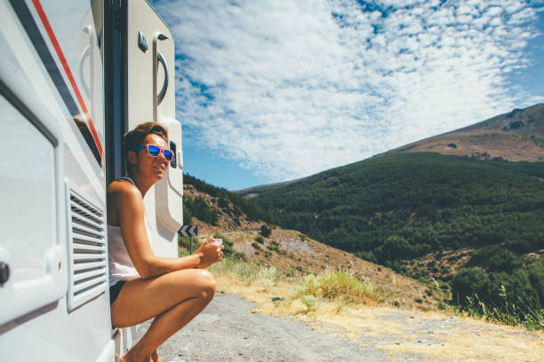 istock Girl with a cup in a motor home 951081144