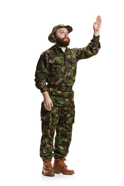 istock Young army soldier wearing camouflage uniform isolated on white 951087206