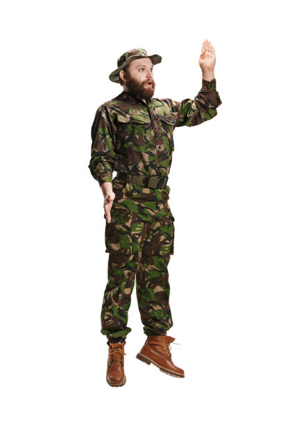 istock Young army soldier wearing camouflage uniform isolated on white 951087276