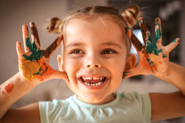 istock Cute little girl with painted hands. 951087740
