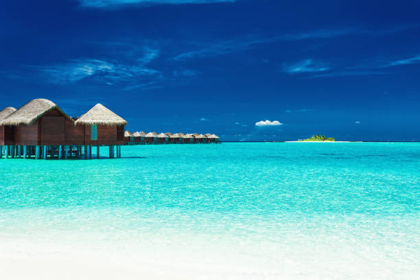 istock Over water bungalows with steps into lagoon, Maldives 951088344