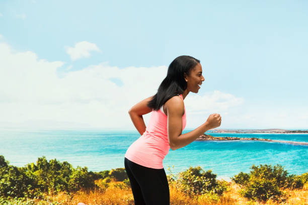 istock Beautiful female standing by the ocean 951091810