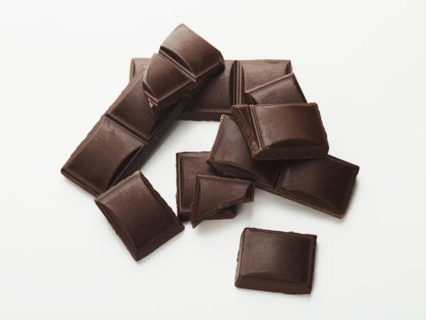 istock Bar of dark chocolate isolated on white 951092182