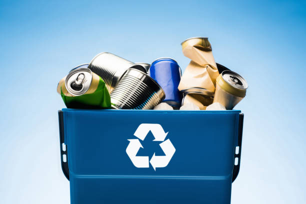 istock various metal cans in trash bin with recycle sign 951094448