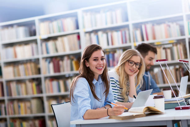 istock University students working in the library at campus 951095644