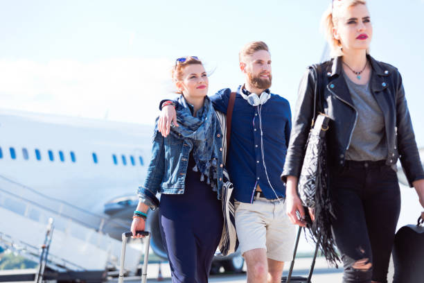 istock Young couple deboarding the airplane 951096034