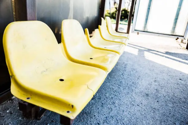 Photo of damaged yellow chairs