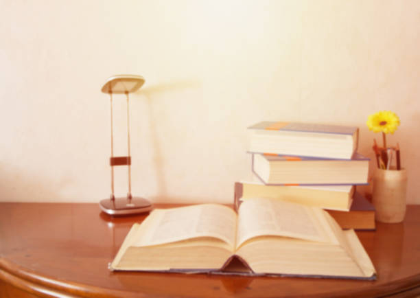 istock Open book on wood desk with blurred soft focus for education background and back to school concept, vintage tone style. 951097848