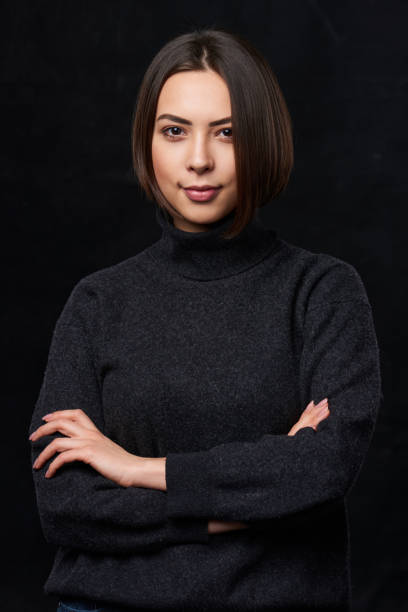 istock Confident female in grey sweater smiling 951101626