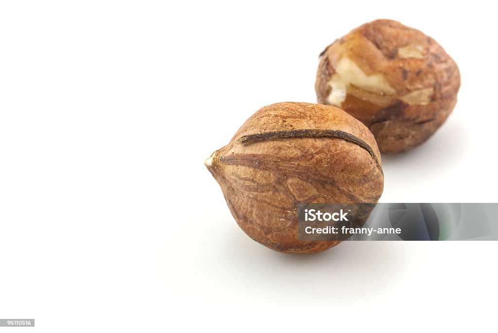 Two Hazelnuts - Closeup on White  Close-up Stock Photo