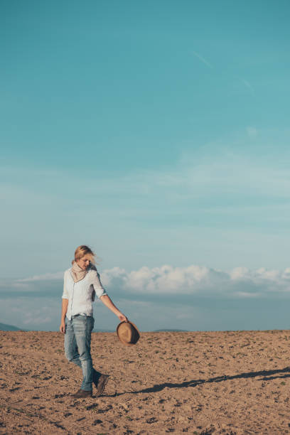 istock Traveller woman walking in desert. 951106628