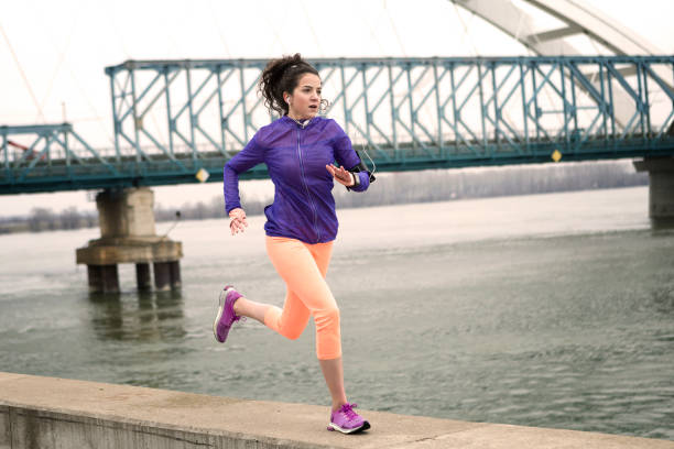istock Young woman runner finishing lap 951112696