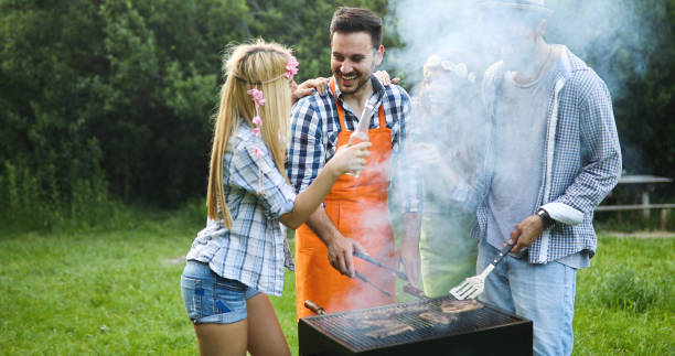 istock Happy people having camping and having bbq party 951112814