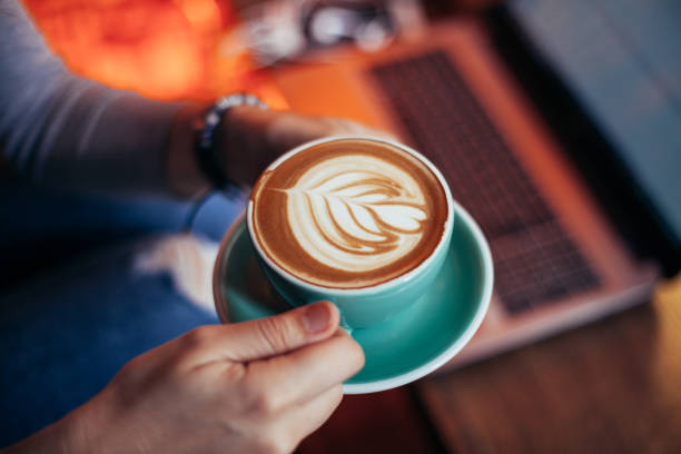 istock Woman holding cup with sth heart-shaped 951113396