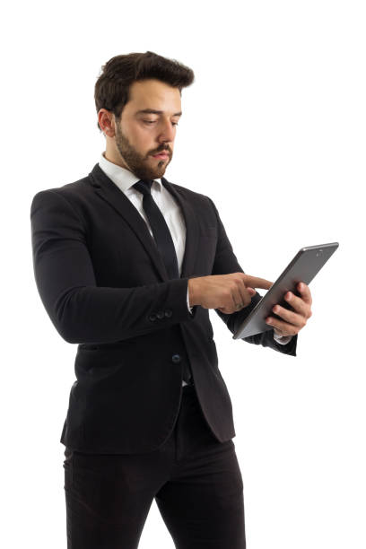 istock Man is using a digital tablet. Beautiful and elegant person is wearing black suit.