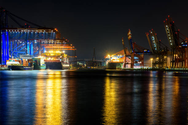 istock Container ships in the harbour at night, Hamburg 951116450