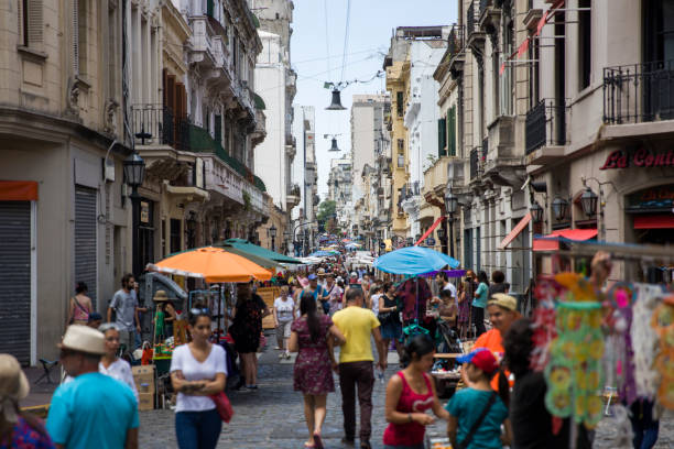 Unidentified people on San Telmo flea market in Buenos Aires, Argentina. This street market takes place every Sunday morning.