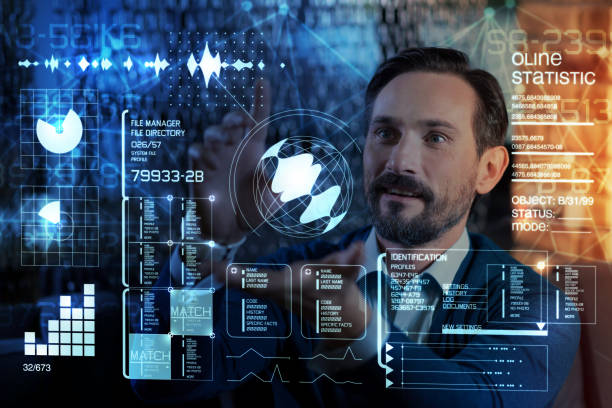 istock Clever programmer admiring the options of his futuristic screen 951118026