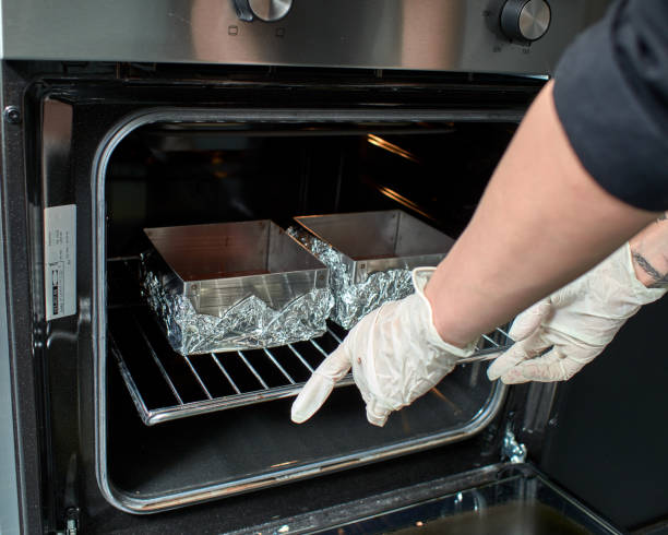 istock Step-by-step preparation of black designer cake. Baking. 951121712