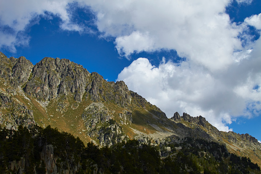 Pyrenees mountains peak with cloudy blue sky