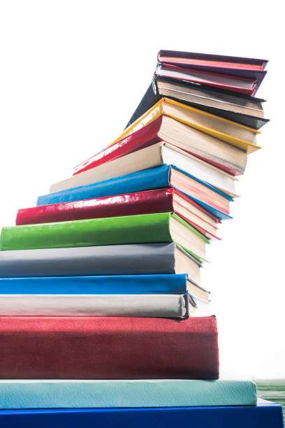 istock Spiral tower of colorful stacked books 951125976