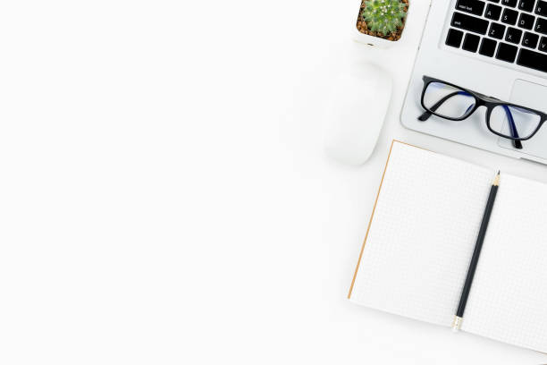 istock Modern white office desk table with laptop and supplies. Top view with copy space, flat lay. 951126810