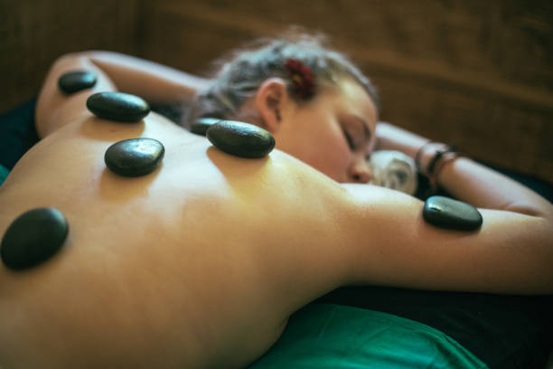 istock Young woman during lastone therapy 951126892