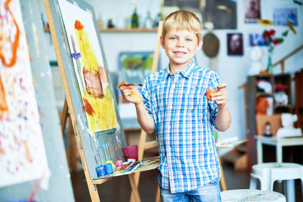 istock Happy Little Boy Enjoying  Art Class 951133748