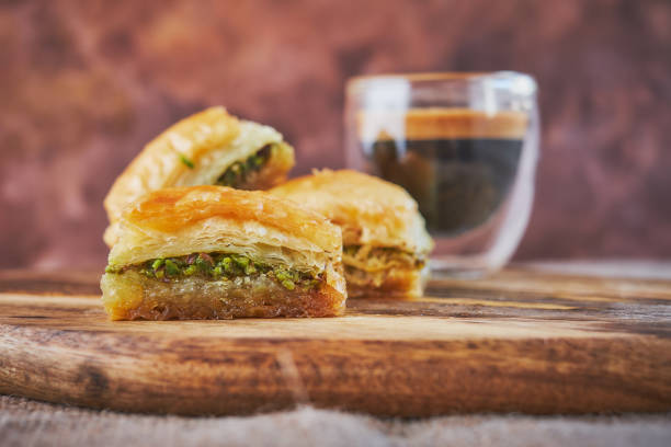 istock Baklava and espresso coffee on a board of mango wood 951136012