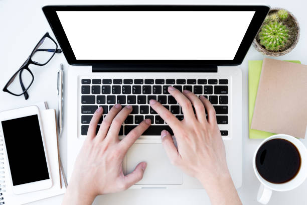 istock Man is typing on laptop keyboard. Top view with copy space, flat lay. 951137502