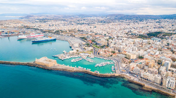 Birds eye view of Heraklion, Crete Greece Drone capture of the harbour, fort and the cityscape of Heraklion, Crete Greece herakleion photos stock pictures, royalty-free photos & images