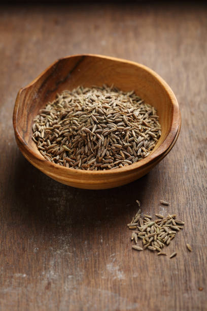 istock Cumin on wooden background, spice 951144132