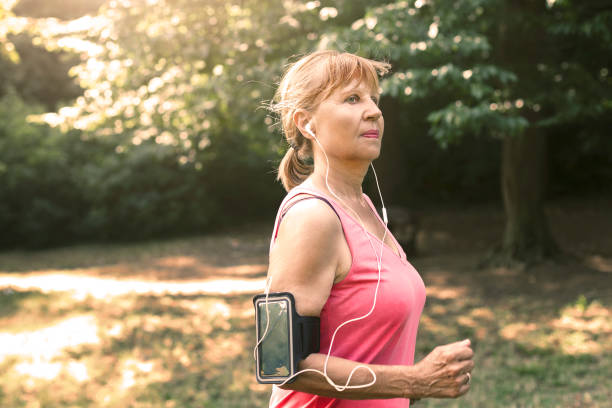 istock Senior woman jogging in park 951147128