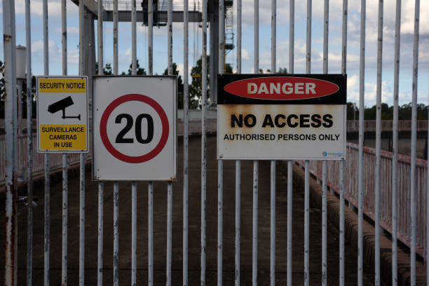 North Pine Dam, Queensland, Australia 'Danger No Access' sign on security gates on the wall of North Pine Dam at Lake Samsonvale. speed limit sign australia stock pictures, royalty-free photos & images