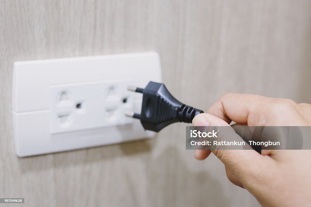 Putting Plug In Hand Putting Plug Into Electricity Socket Stock Photo - Download Image ...