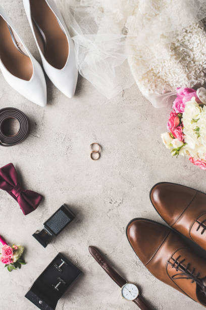 istock top view of wedding accessories and rings on gray tabletop 951154204