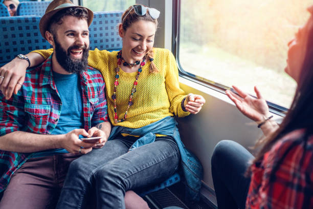 istock Young cheerful people travelling by train 951154486