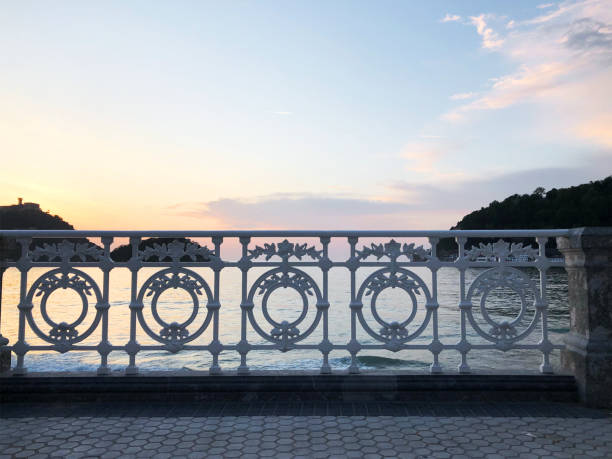 Sunset Sea Landscape through metal fence