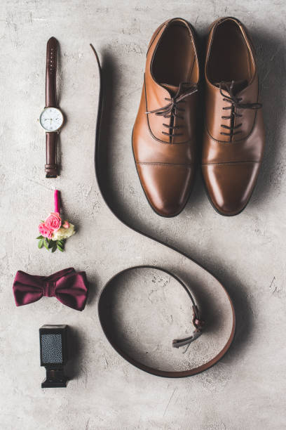 istock elevated view of male wedding accessories on gray surface 951154802