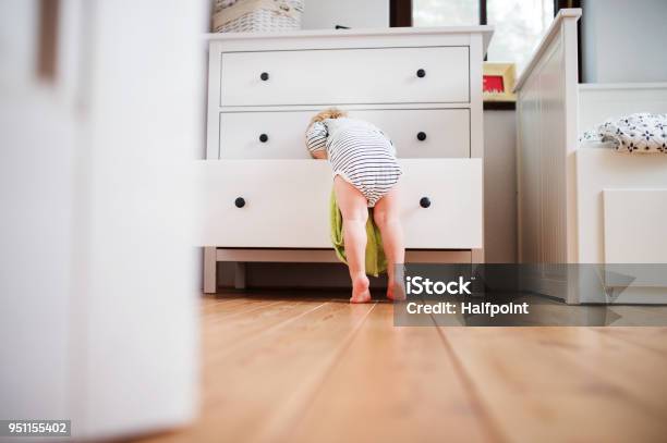 Toddler Boy In A Dangerous Situation At Home Stock Photo - Download Image Now - Child, Baby - Human Age, Domestic Life