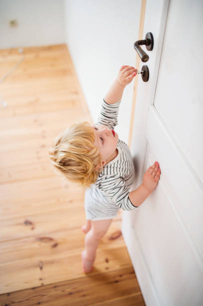 istock Toddler child in a dangerous situation at home. 951155478