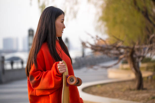 istock Girl with a skateboard in the park 951155558