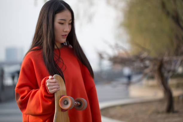 istock Girl with a skateboard in the park 951155584