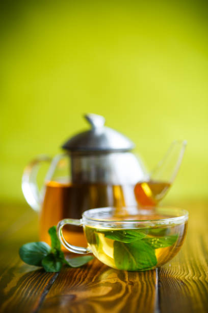 istock hot green tea with fresh mint 951159418