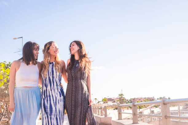 istock group of three young woman walking in vacation 951159696