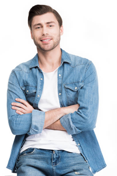 istock young man with crossed arms looking at camera, isolated on white 951160170