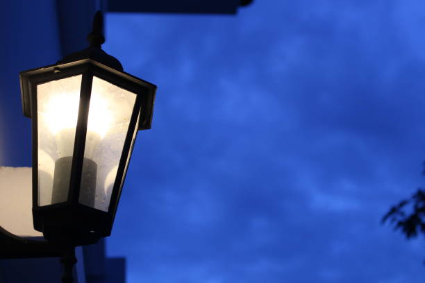 istock Yellow lantern front of house on blue sky background with copy space, Night light 951168878